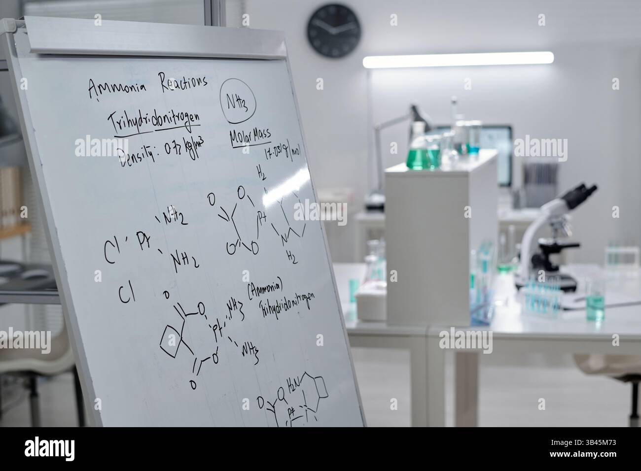 Whiteboard with chemical equations, highlighting reactions and ...