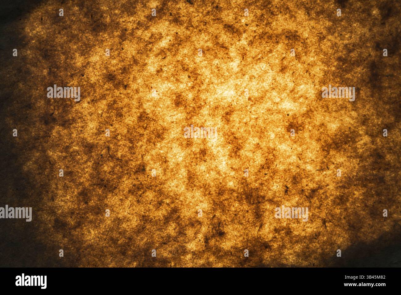 illuminated old paper background. grunge background with space for text. Stock Photo