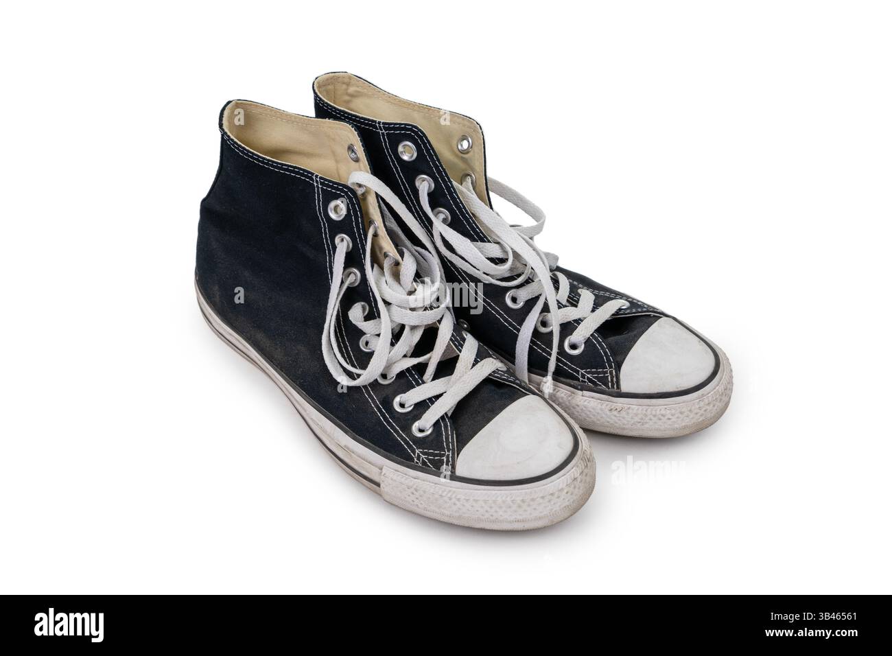 Pair of worn black old school sneakers isolated on white background ...