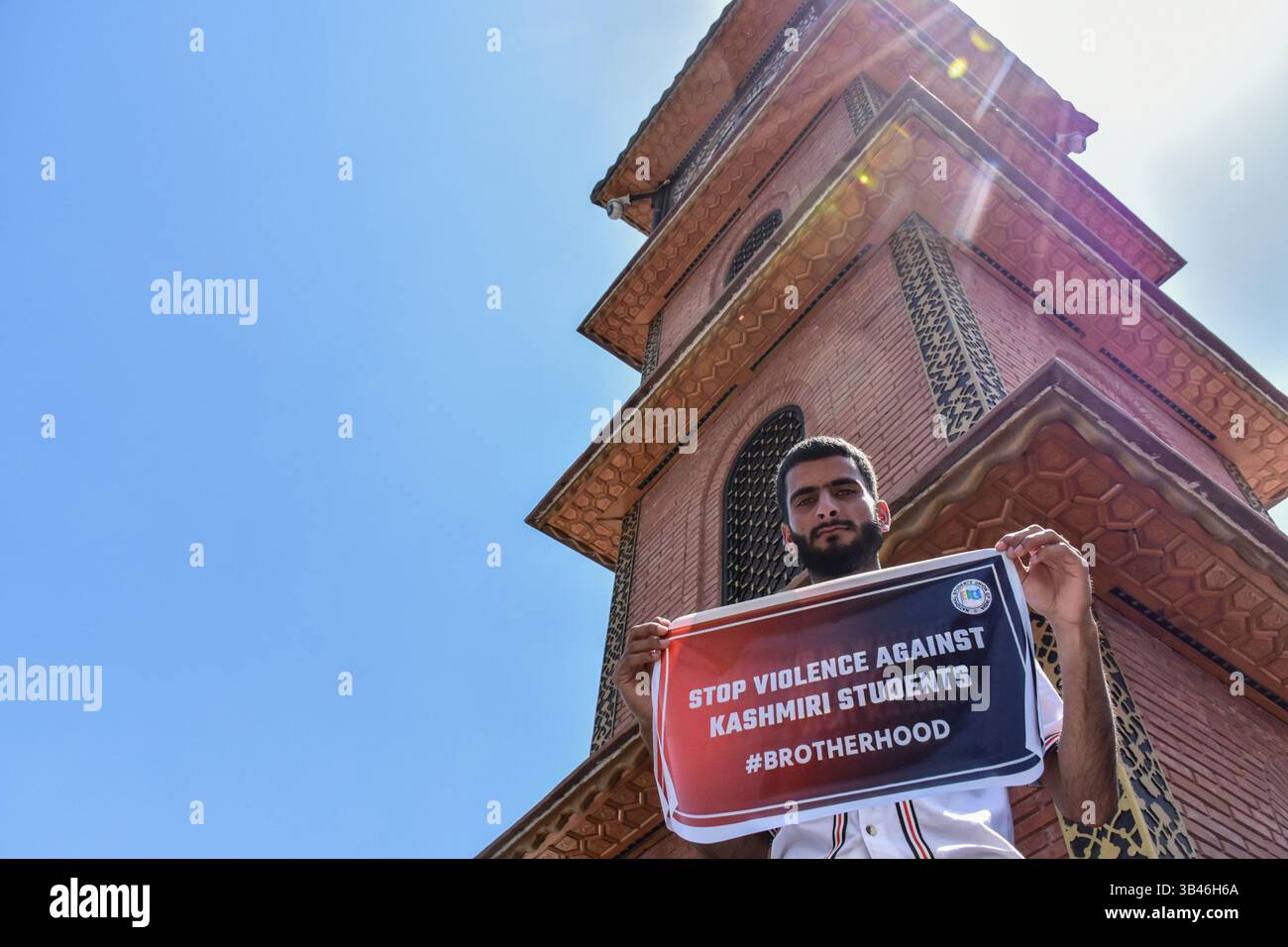 A Kashmiri student holds a placard during a protest following the ...