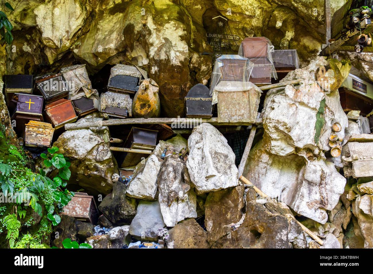 Many coffins in different shapes at Londa Cave Burial Site. Toraja ...