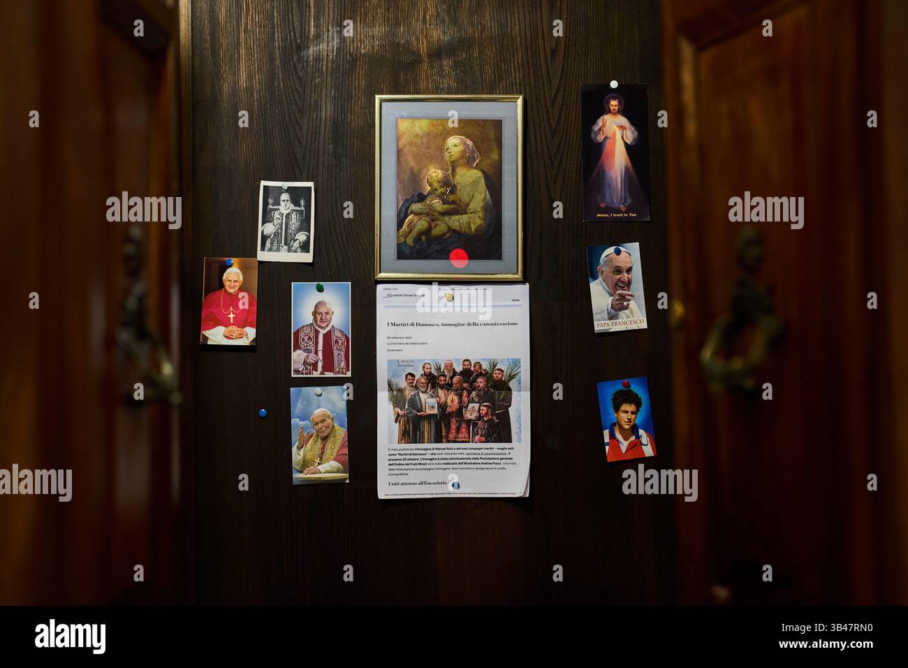 Pictures of popes and religious iconography hang inside a confessional ...