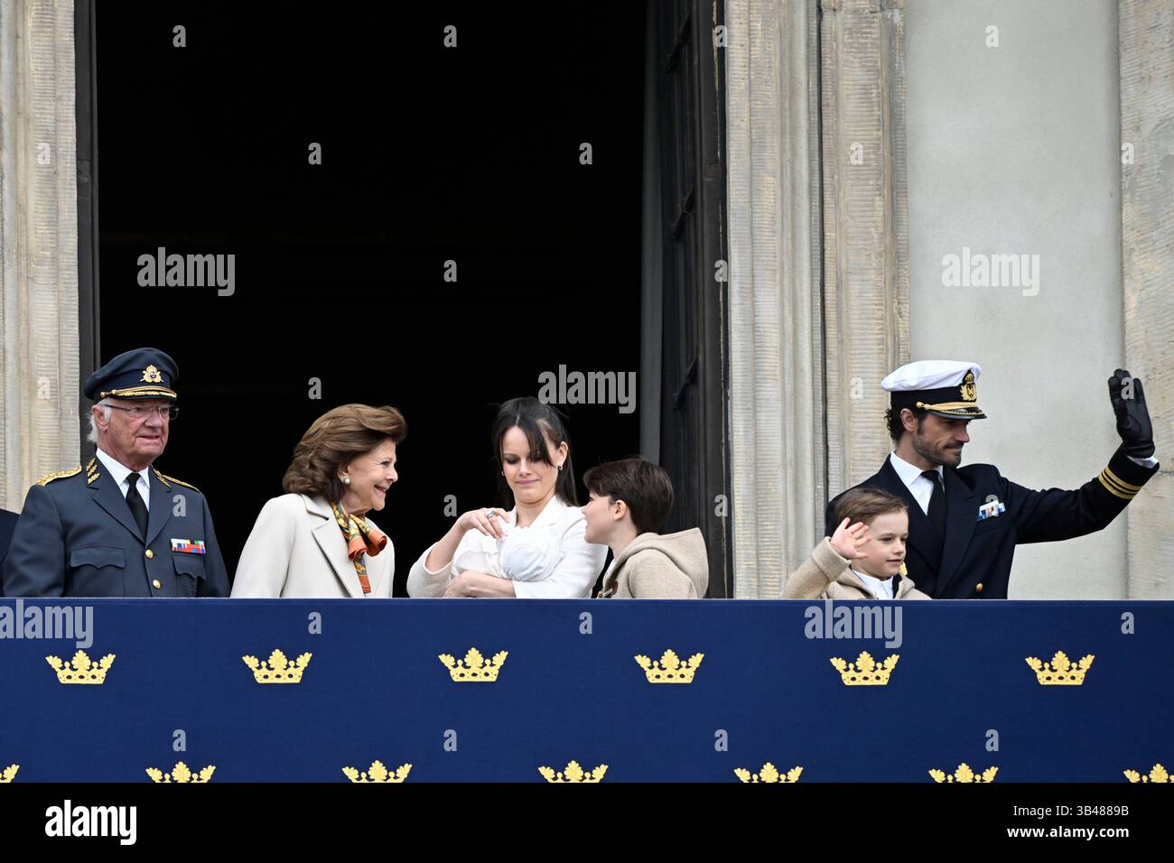 King Carl Gustaf, Queen Silvia, Princess Sofia holding baby Princess