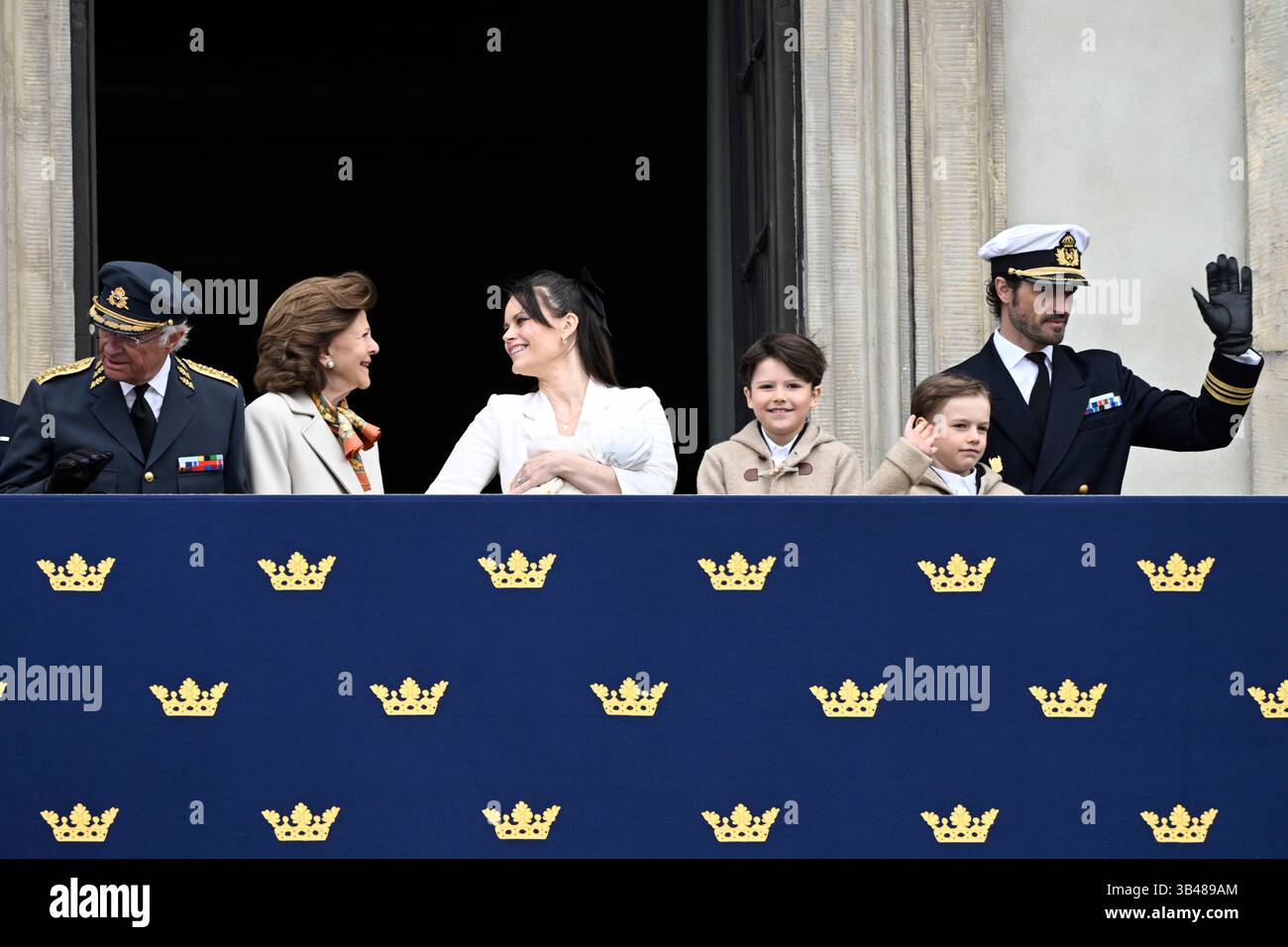 King Carl Gustaf, Queen Silvia, Princess Sofia holding baby Princess