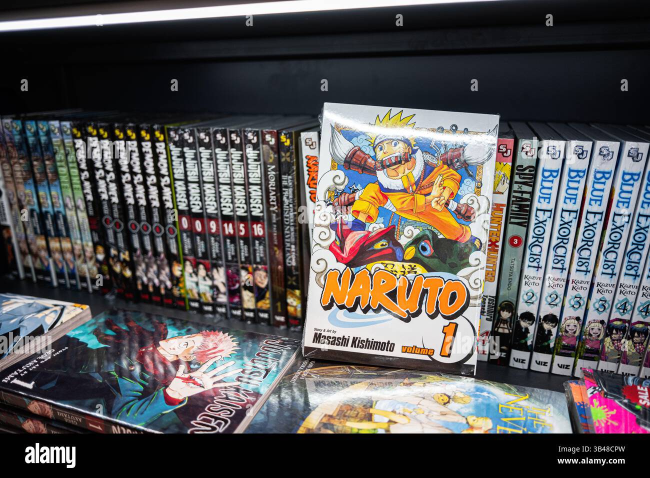 Ivano-Frankivsk, Ukraine - April 29, 2025: Manga books displayed on a shelf, highlighting Naruto by Masashi Kishimoto and other popular titles. Stock Photo