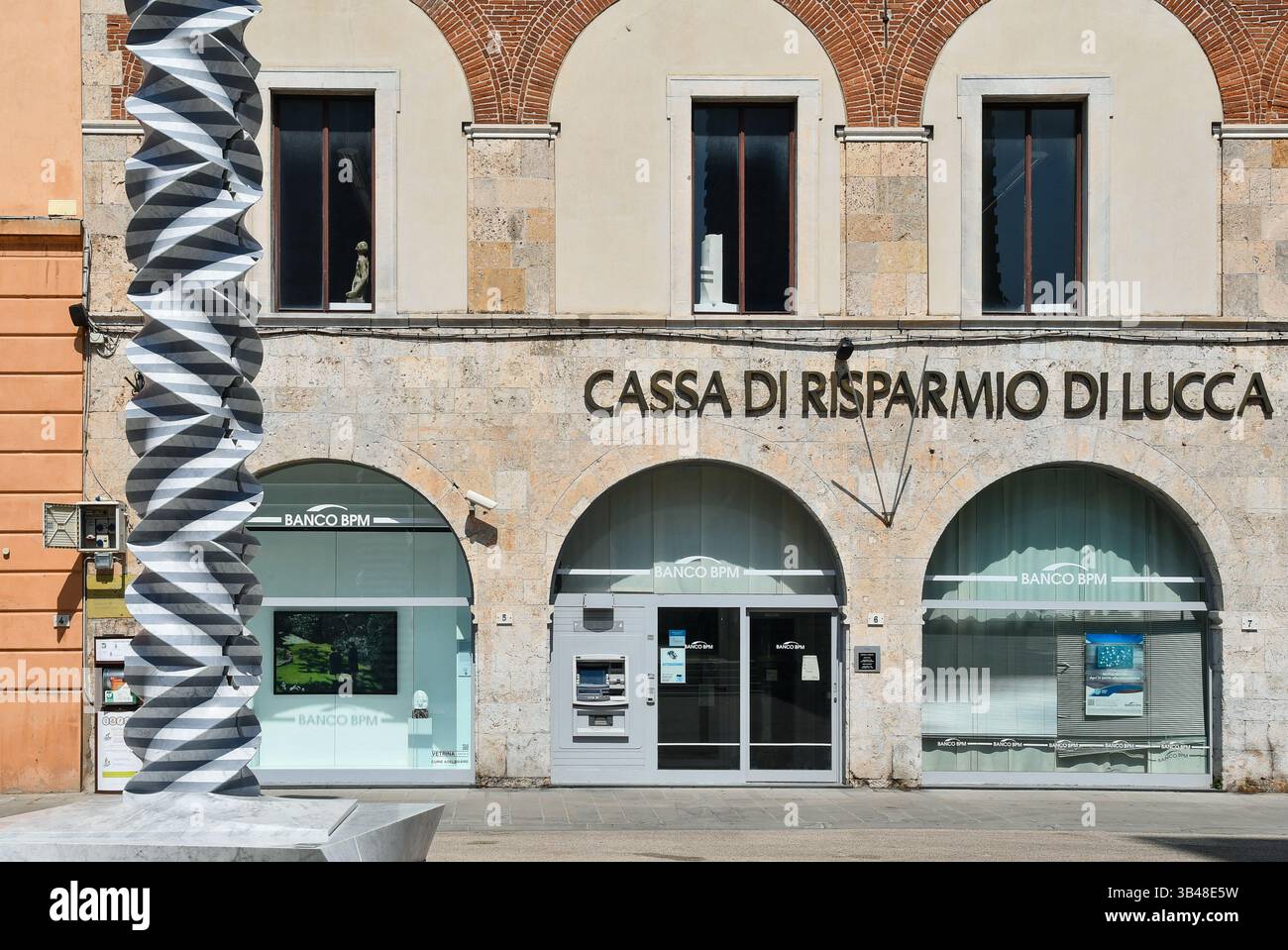 Cassa di Risparmio Bank exterior Campo Manin woman walking past black and  white Stock Photo - Alamy, image size:1300x959
