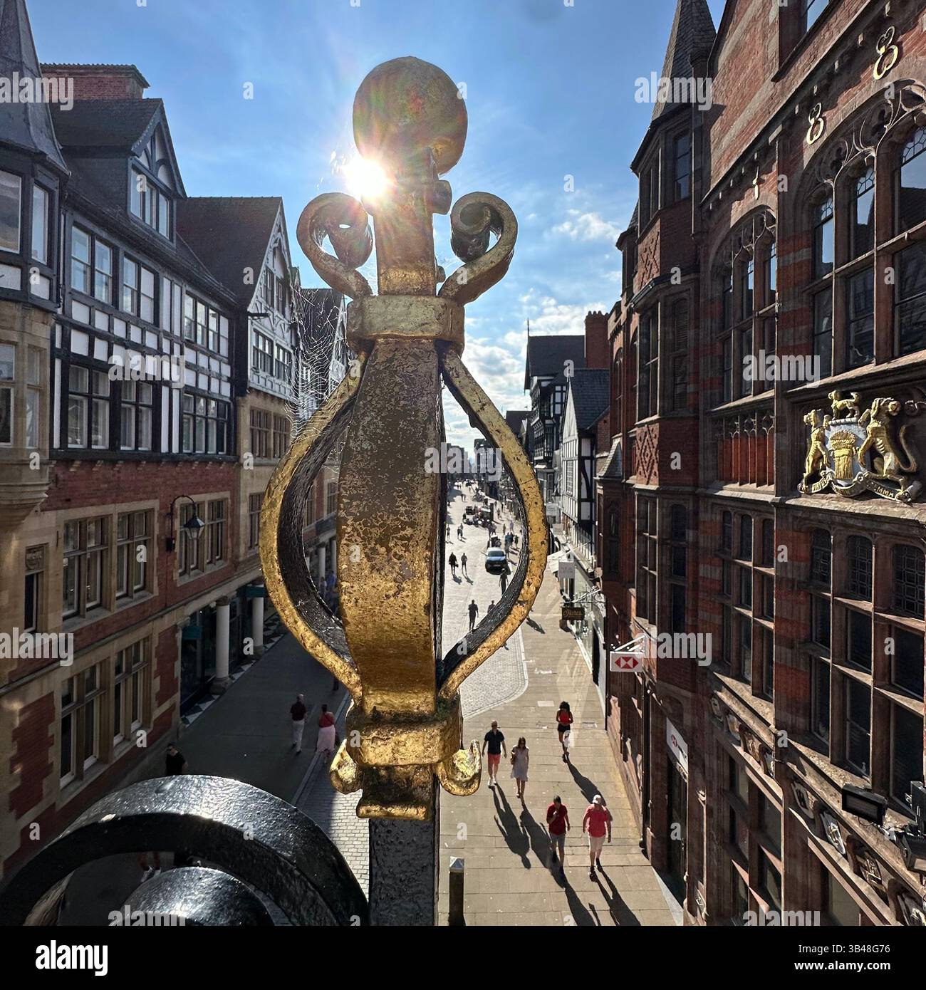 Westward view down Eastgate Street, Chester, through ornate Eastgate Clock railings. People on street, taken 3 September 2023. Editorial use only. - Smartphone Captured Stock Image