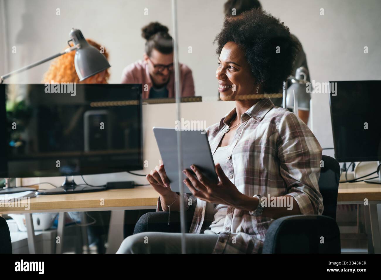 Software, coding and business woman on tablet thinking of data analytics, digital technology. Stock Photo