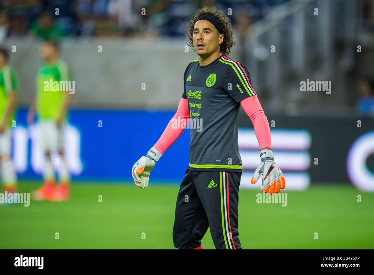 HOUSTON, TX - JULY 13: Honduras midfielder Edwin Solano (19) and Grenada  forward Benjamin Ettienne (2) fight to volley the ball during the CONCACAF  Gold Cup Group D soccer match between Honduras