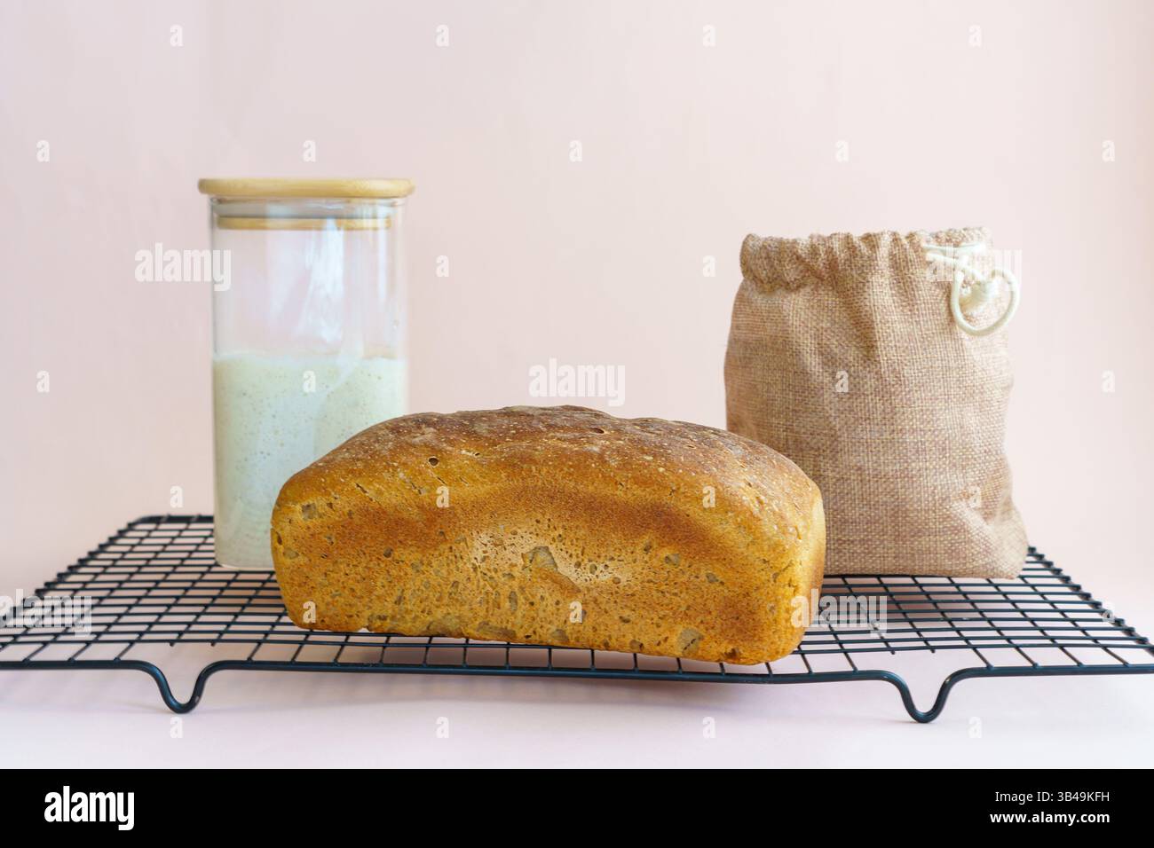 sourdough rye bread rectangular brick shape. Sourdough in a jar and a ...