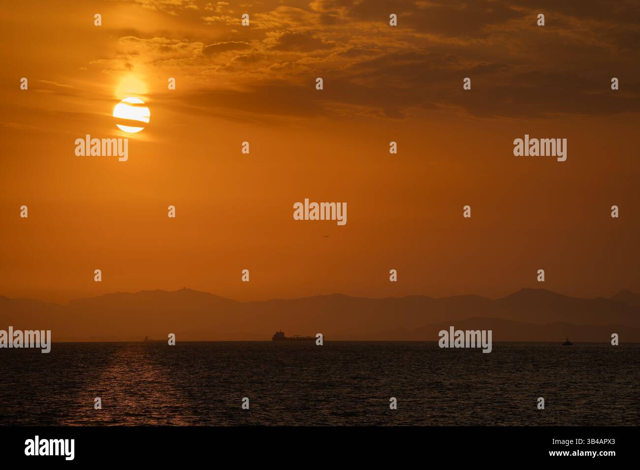 Sunset over China with an orange sky Stock Photo