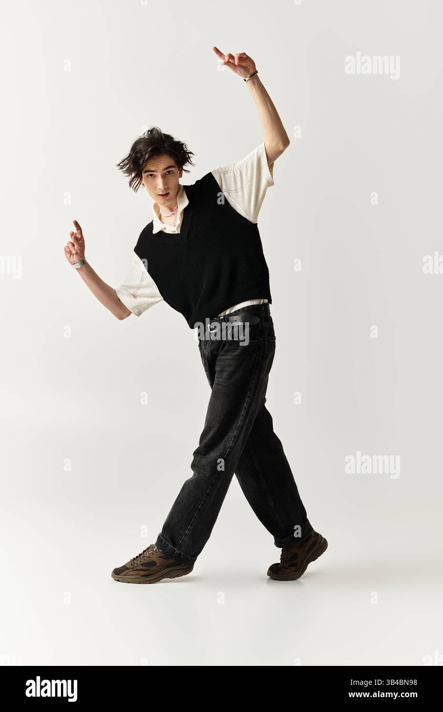 A handsome young man poses confidently in a stylish outfit, embodying ...