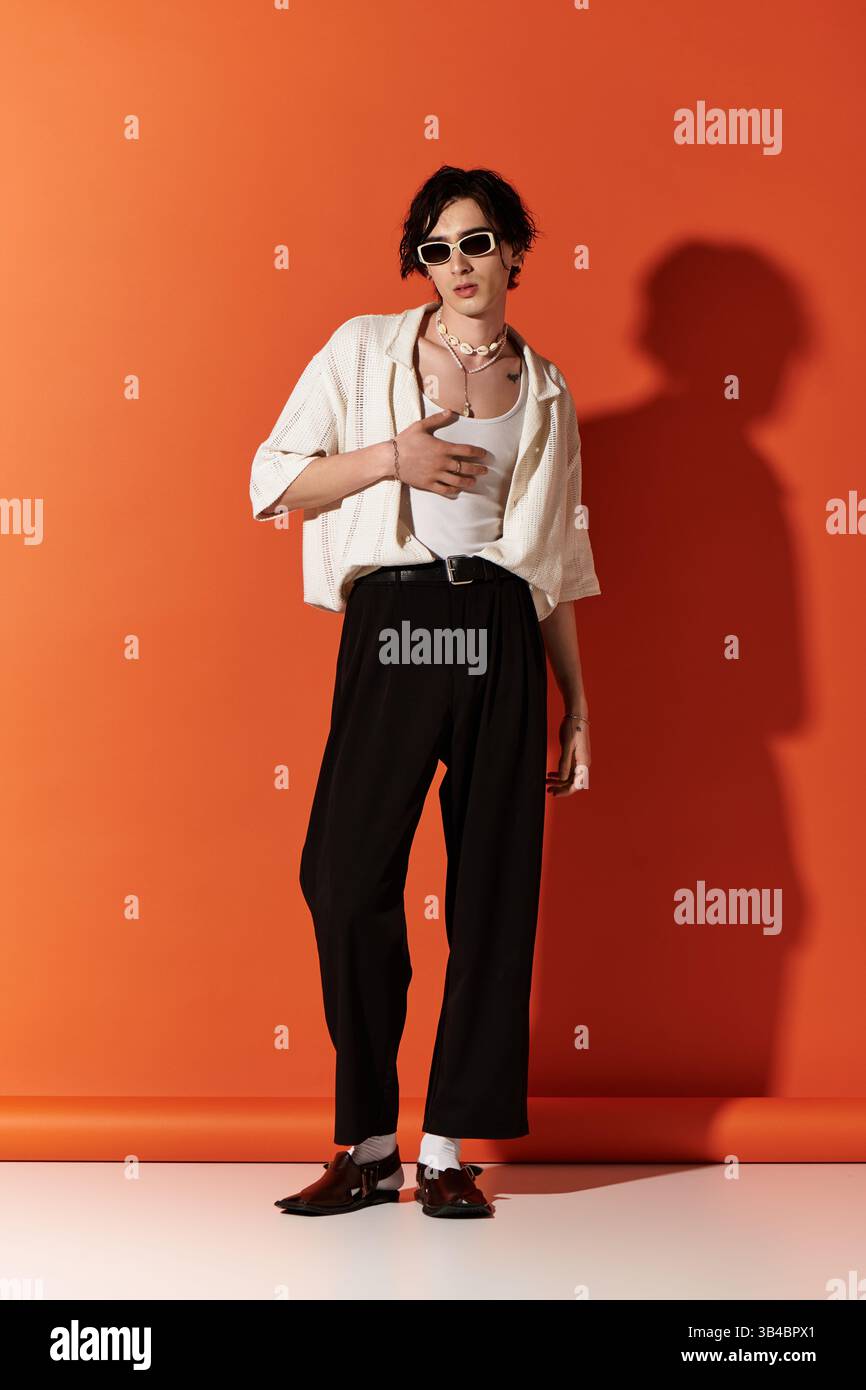 Stylish young man poses confidently in a summer outfit, expressing ...