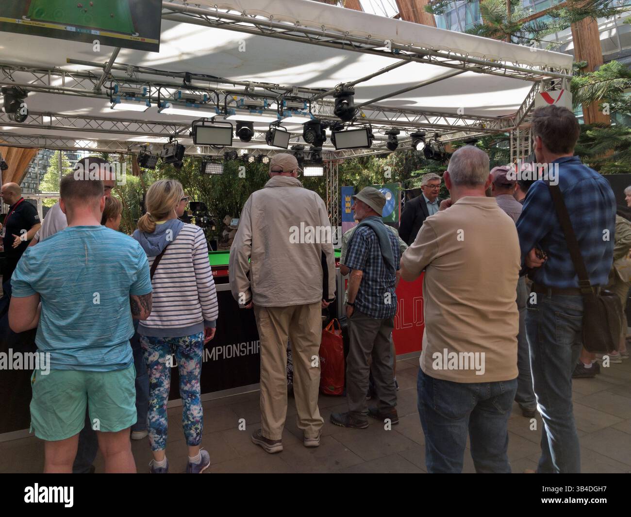 Public crowd in the Sheffield Winter Garden, watching the indoor studio World Championship Snooker, Sports Broadcast, England UK, 2025 - Smartphone Captured Stock Image