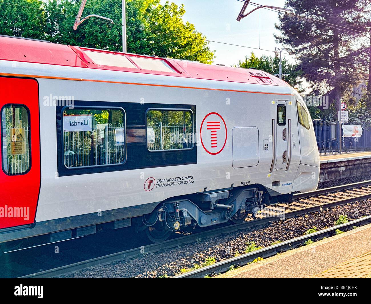 Cardiff, Wales, UK - 29 April 2025: Class 756 commuter train at Llandaff North railway station. The locomotive was built for Transport for Wales. - Smartphone Captured Stock Image