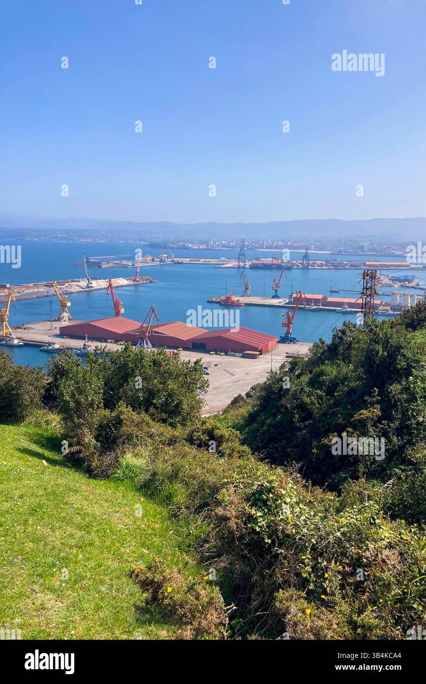 GIJON, SPAIN - APRIL  7, 2025: Gijón port settlements amidst scenic coastal landscapes in Gijón, Asturias, Spain - Smartphone Captured Stock Image
