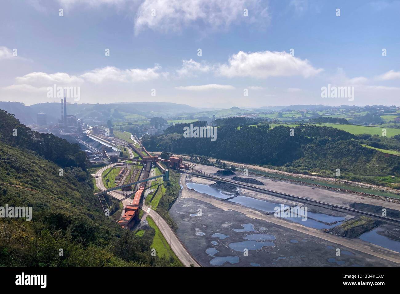 GIJON, SPAIN - APRIL  7, 2025: Gijón port settlements amidst scenic coastal landscapes in Gijón, Asturias, Spain - Smartphone Captured Stock Image