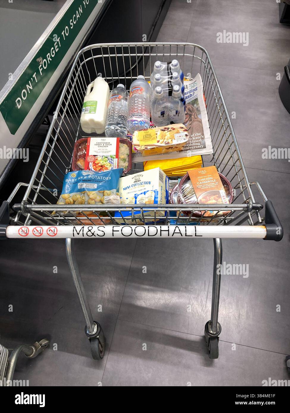 At checkout with Shopping trolley groceries in a Marks and Spencer food hall - Smartphone Captured Stock Image