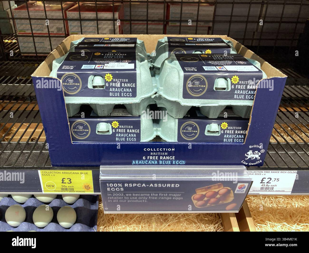 Egg boxes with 6 free range Araucana Blue Eggs for sale at Marks and Spencer, UK - Smartphone Captured Stock Image