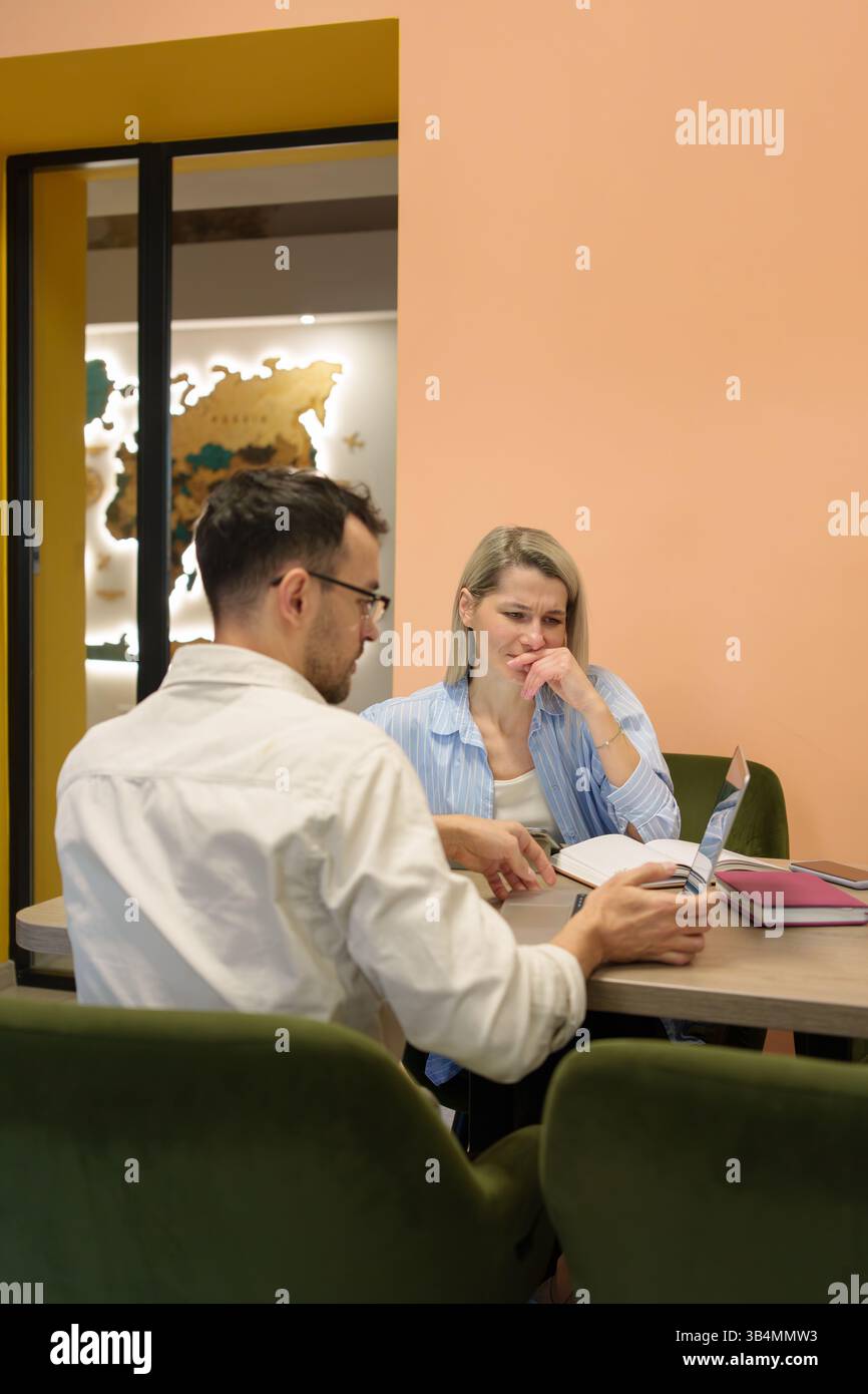 Professional collaboration between colleagues in a modern office space setting Stock Photo