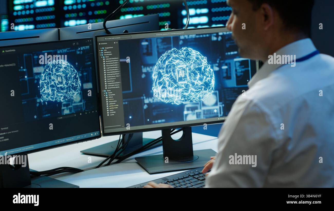 Computer scientist using AI tech on PC to do checkup in server room. IT staff member in data center using artificial intelligence technology to process datasets for training, camera A Stock Photo
