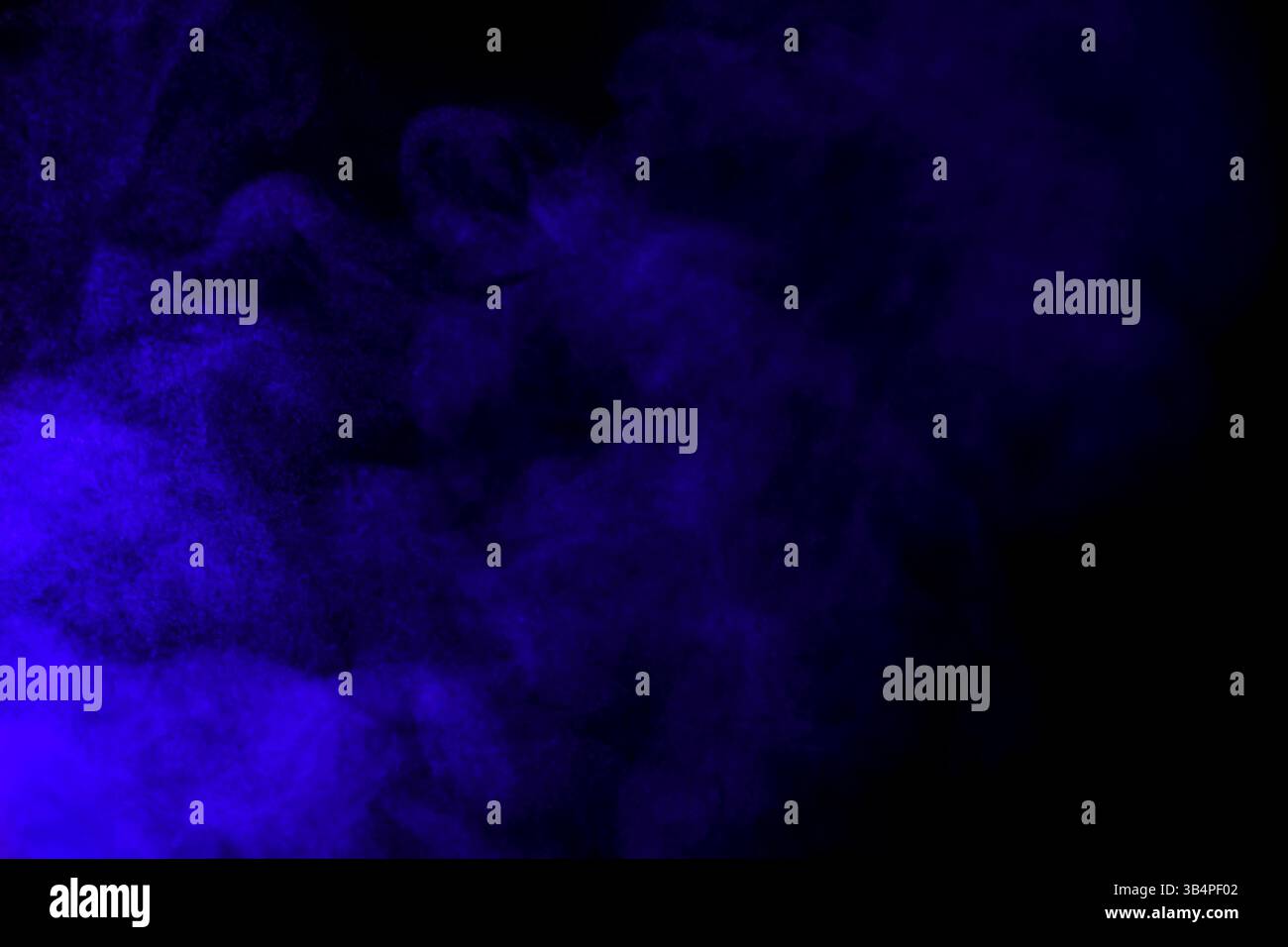 Bright blue smoke in air on black background Stock Photo - Alamy