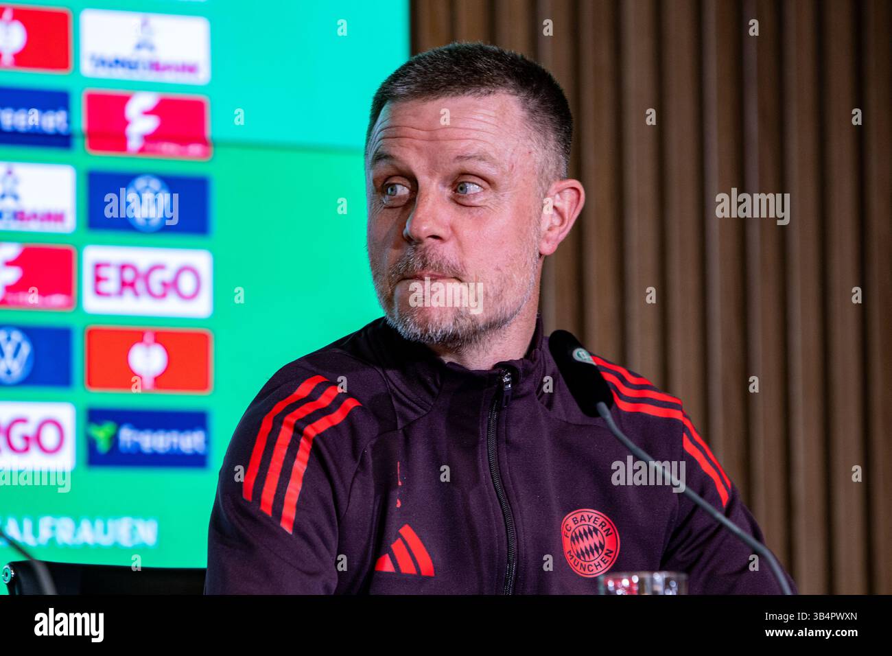 Cologne, North Rhine-Westphalia, Germany. 30th Apr, 2025. FC Bayern Munich head coach ALEXANDER STRAUS looks right during the press conference the day before the Women's DFB Cup final in the RheinEnergieStadion in Cologne, Germany on April 30, 2025. (Credit Image: © Kai Dambach/ZUMA Press Wire) EDITORIAL USAGE ONLY! Not for Commercial USAGE! Stock Photo