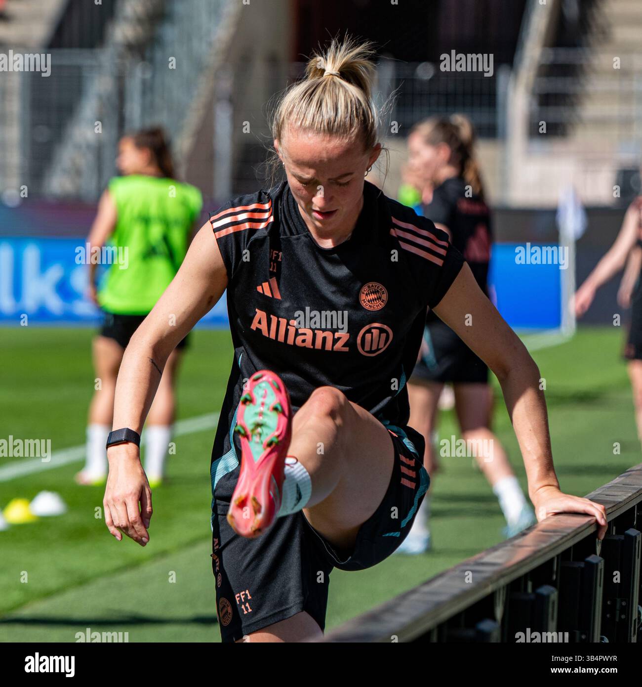 Cologne, North Rhine-Westphalia, Germany. 30th Apr, 2025. FC Bayern Munich forward LEA SCHULLER (11, front) warms up during the FC Bayern Munich practice the day before the Women's DFB Cup final in the RheinEnergieStadion in Cologne, Germany on April 30, 2025. (Credit Image: © Kai Dambach/ZUMA Press Wire) EDITORIAL USAGE ONLY! Not for Commercial USAGE! Stock Photo