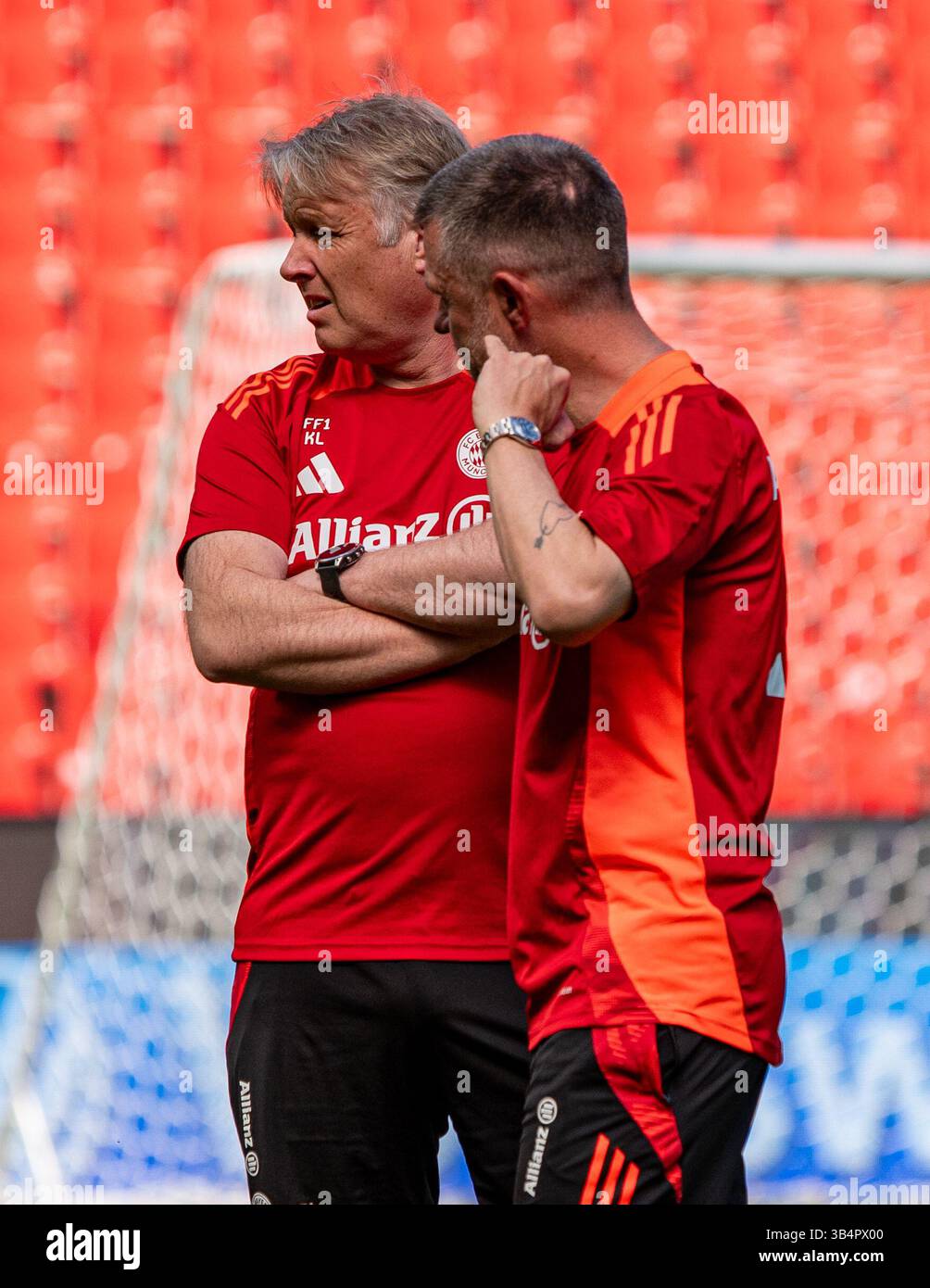 Cologne, North Rhine-Westphalia, Germany. 30th Apr, 2025. FC Bayern Munich assistant coach KJETIL LONE (left) speaks with head coach ALEXANDER STRAUS (right) during the FC Bayern Munich practice the day before the Women's DFB Cup final in the RheinEnergieStadion in Cologne, Germany on April 30, 2025. (Credit Image: © Kai Dambach/ZUMA Press Wire) EDITORIAL USAGE ONLY! Not for Commercial USAGE! Stock Photo