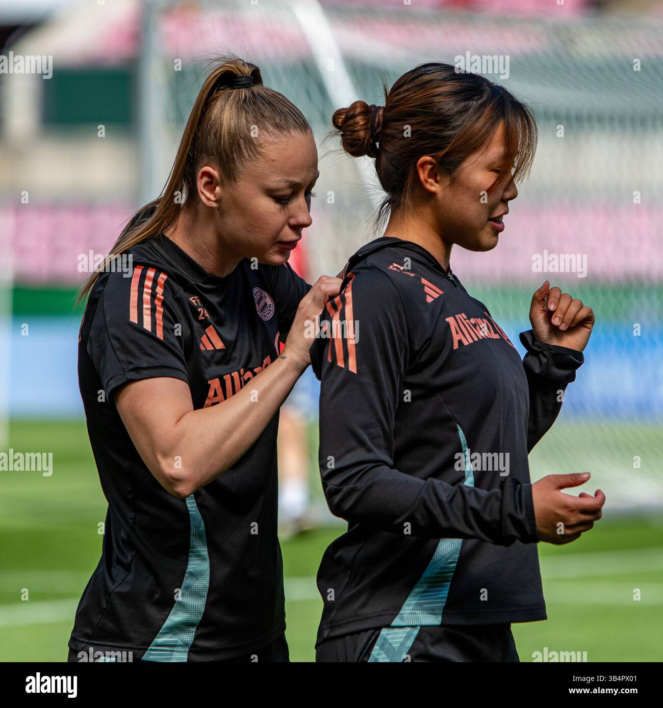Cologne, North Rhine-Westphalia, Germany. 30th Apr, 2025. FC Bayern Munich forward WERONIKA ZAWISTOWSKA (24, left) pulls back the shirt of midfielder MOMOKO TANIKAWA (18, right) during the FC Bayern Munich practice the day before the Women's DFB Cup final in the RheinEnergieStadion in Cologne, Germany on April 30, 2025. (Credit Image: © Kai Dambach/ZUMA Press Wire) EDITORIAL USAGE ONLY! Not for Commercial USAGE! Stock Photo