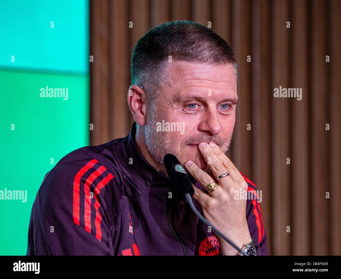 Cologne, North Rhine-Westphalia, Germany. 30th Apr, 2025. FC Bayern Munich head coach ALEXANDER STRAUS puts his hand to his lips during the press conference the day before the Women's DFB Cup final in the RheinEnergieStadion in Cologne, Germany on April 30, 2025. (Credit Image: © Kai Dambach/ZUMA Press Wire) EDITORIAL USAGE ONLY! Not for Commercial USAGE! Stock Photo