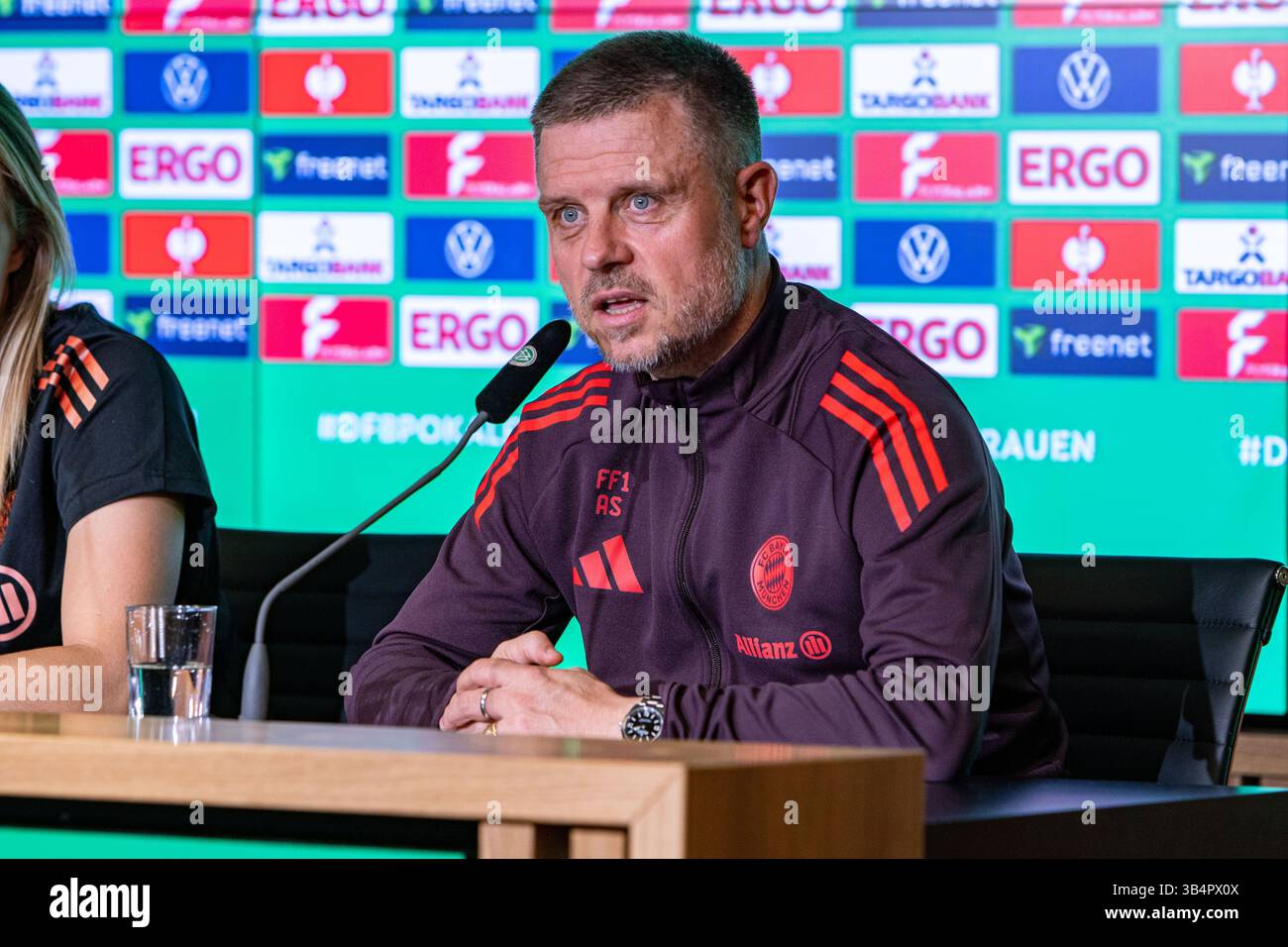 Cologne, North Rhine-Westphalia, Germany. 30th Apr, 2025. FC Bayern Munich head coach ALEXANDER STRAUS answers a question during the press conference the day before the Women's DFB Cup final in the RheinEnergieStadion in Cologne, Germany on April 30, 2025. (Credit Image: © Kai Dambach/ZUMA Press Wire) EDITORIAL USAGE ONLY! Not for Commercial USAGE! Stock Photo