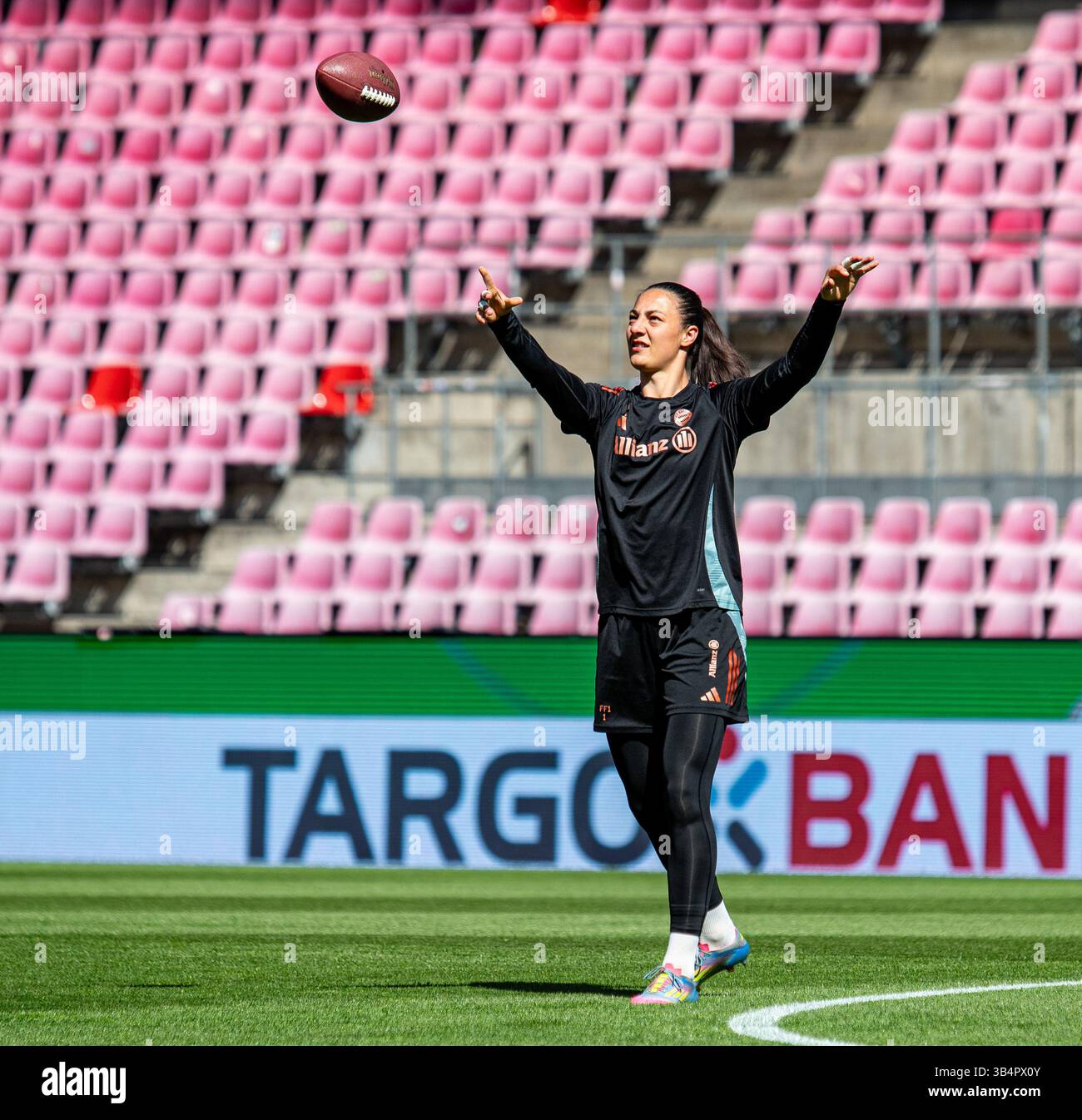Cologne, North Rhine-Westphalia, Germany. 30th Apr, 2025. FC Bayern Munich goalkeeper MARIA LUISA GROHS (1) throws a football during the FC Bayern Munich practice the day before the Women's DFB Cup final in the RheinEnergieStadion in Cologne, Germany on April 30, 2025. (Credit Image: © Kai Dambach/ZUMA Press Wire) EDITORIAL USAGE ONLY! Not for Commercial USAGE! Stock Photo