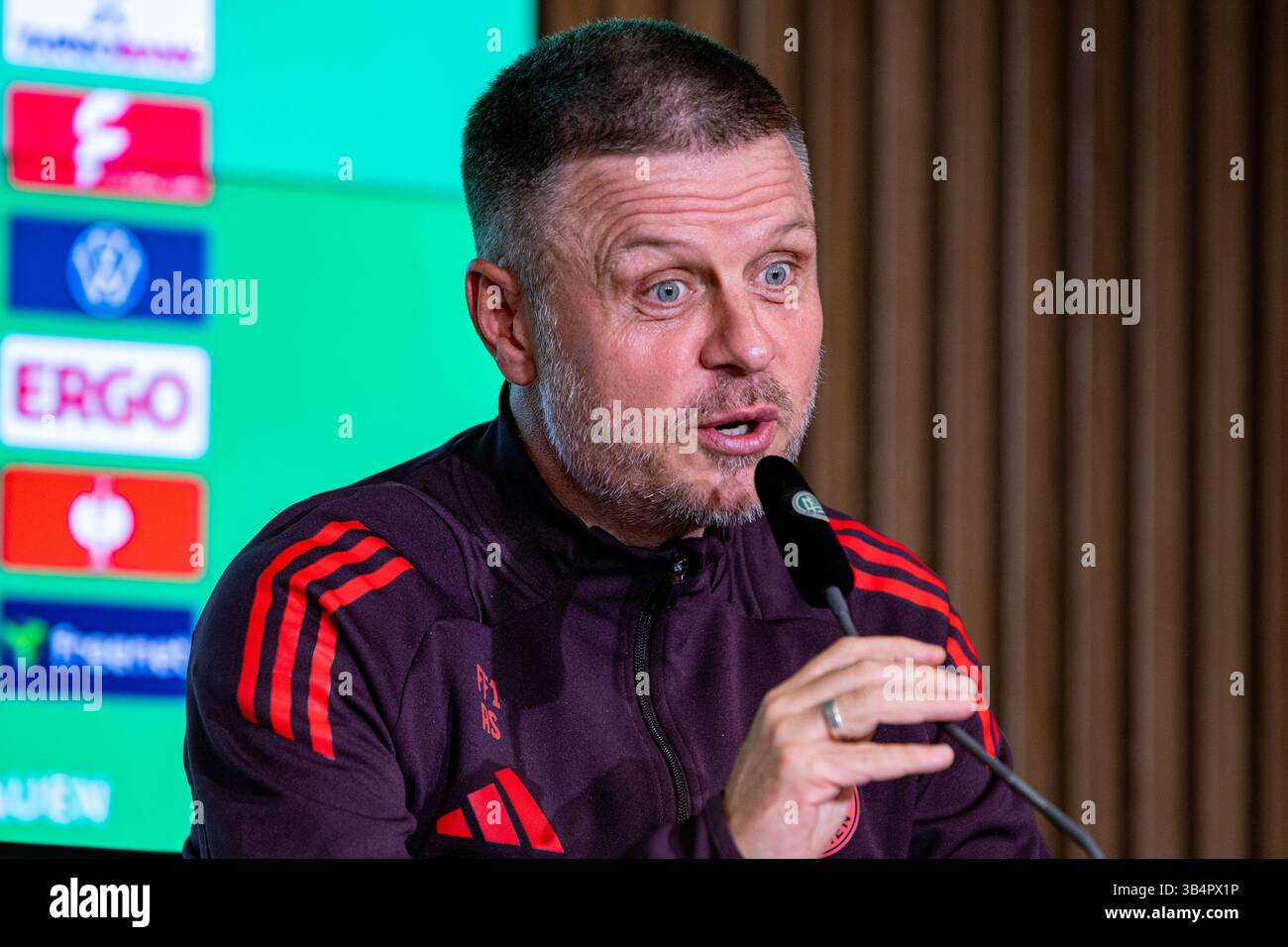 Cologne, North Rhine-Westphalia, Germany. 30th Apr, 2025. FC Bayern Munich head coach ALEXANDER STRAUS answers a question during the press conference the day before the Women's DFB Cup final in the RheinEnergieStadion in Cologne, Germany on April 30, 2025. (Credit Image: © Kai Dambach/ZUMA Press Wire) EDITORIAL USAGE ONLY! Not for Commercial USAGE! Stock Photo