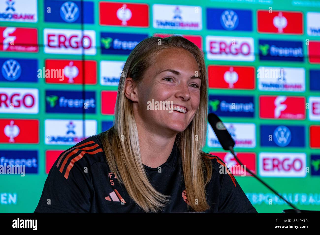 Cologne, North Rhine-Westphalia, Germany. 30th Apr, 2025. FC Bayern Munich captain MAGDALENA ERIKSSON (5) smiles during the press conference the day before the Women's DFB Cup final in the RheinEnergieStadion in Cologne, Germany on April 30, 2025. (Credit Image: © Kai Dambach/ZUMA Press Wire) EDITORIAL USAGE ONLY! Not for Commercial USAGE! Stock Photo