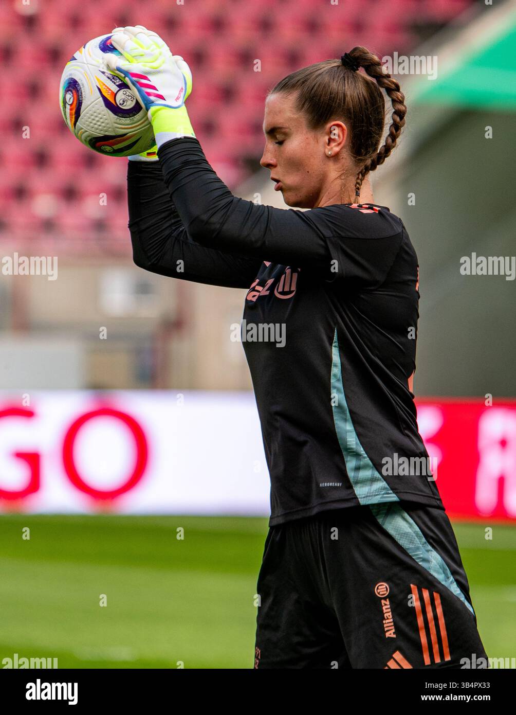 Cologne, North Rhine-Westphalia, Germany. 30th Apr, 2025. FC Bayern Munich goalkeeper ENA MAHMUTOVIC (32) grabs a ball during the FC Bayern Munich practice the day before the Women's DFB Cup final in the RheinEnergieStadion in Cologne, Germany on April 30, 2025. (Credit Image: © Kai Dambach/ZUMA Press Wire) EDITORIAL USAGE ONLY! Not for Commercial USAGE! Stock Photo