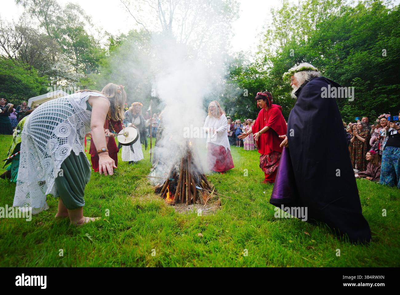 People during the Beltane celebrations at Glastonbury Chalice Well ...