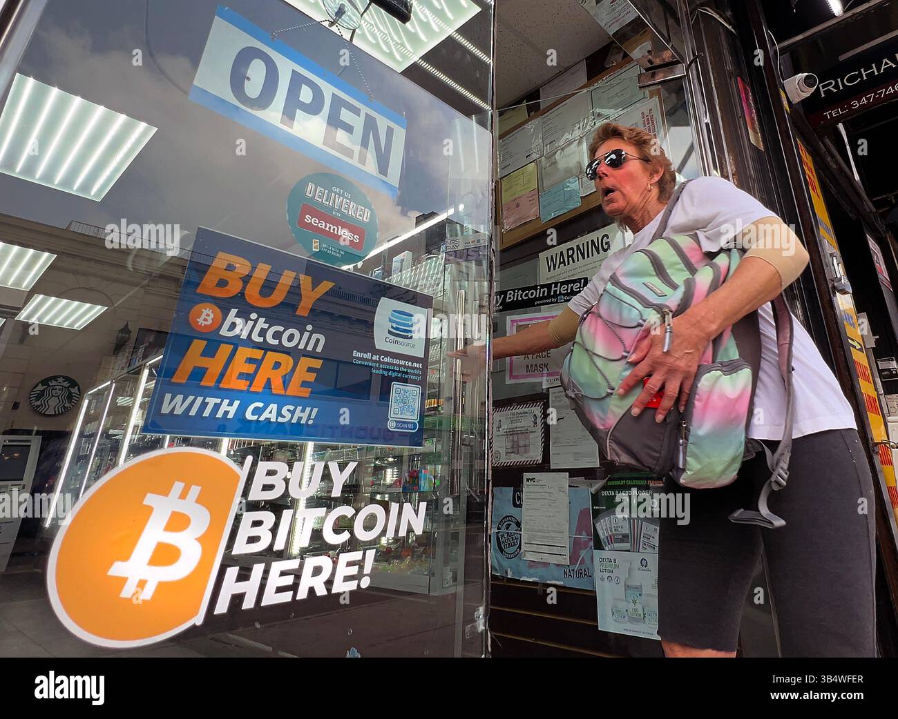 New York, USA. A Bitcoin ATM is advertised in the window of a New York city  deli. Photo by Enrique Shore Stock Photo - Alamy