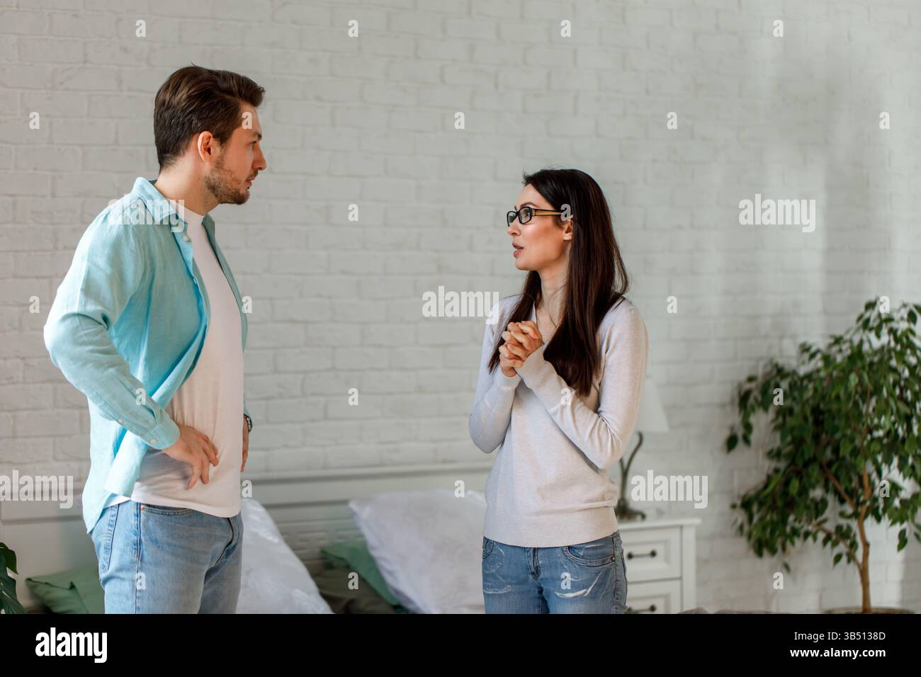 Couple Having Serious Conversation at Home Stock Photo