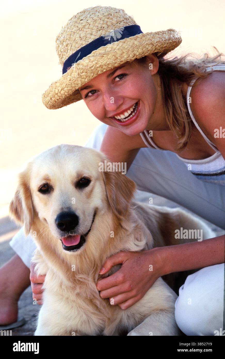 Young woman close up outdoors with her dog. Stock Photo