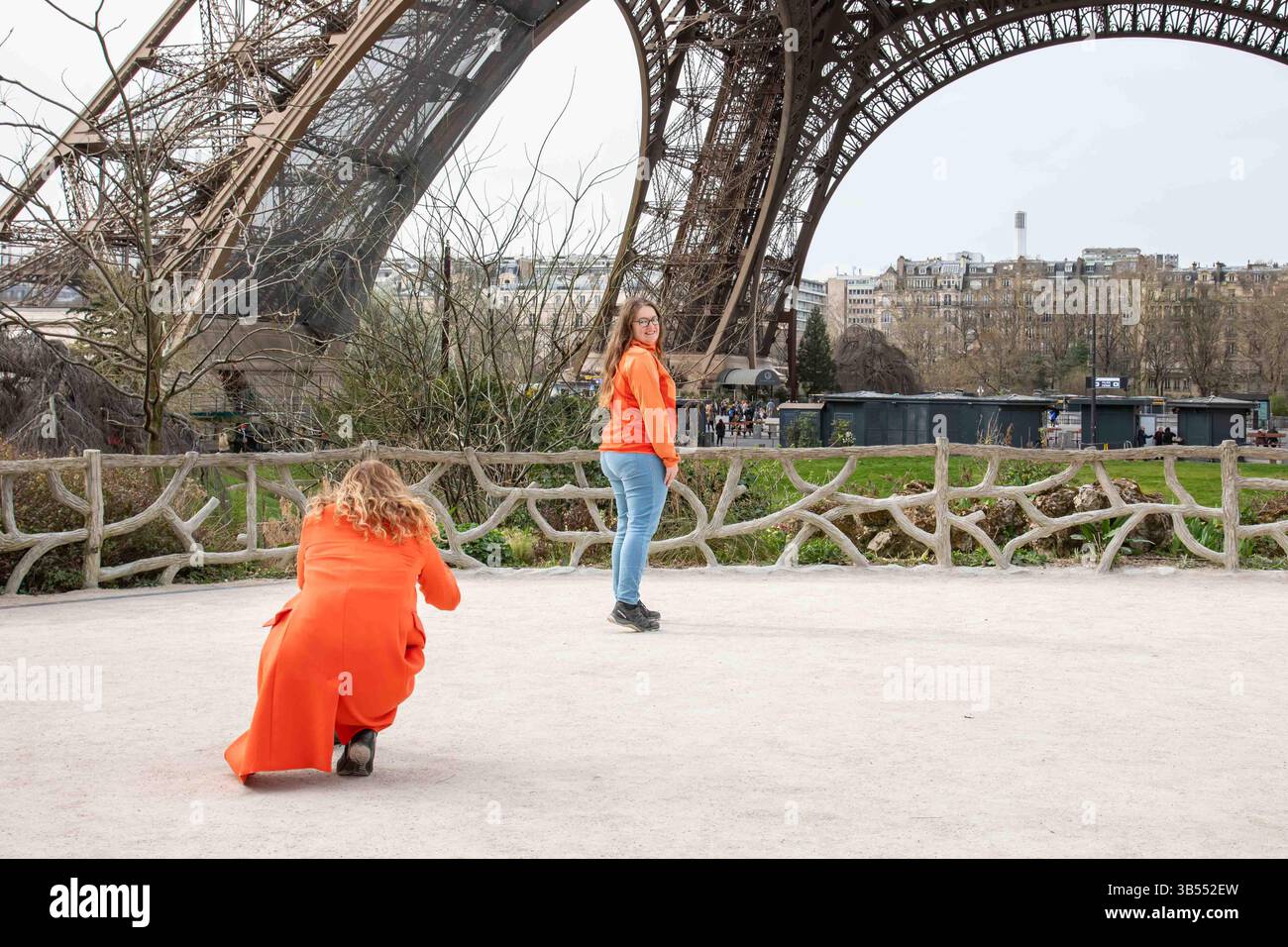 Tourist women taking photographs in the little park next to