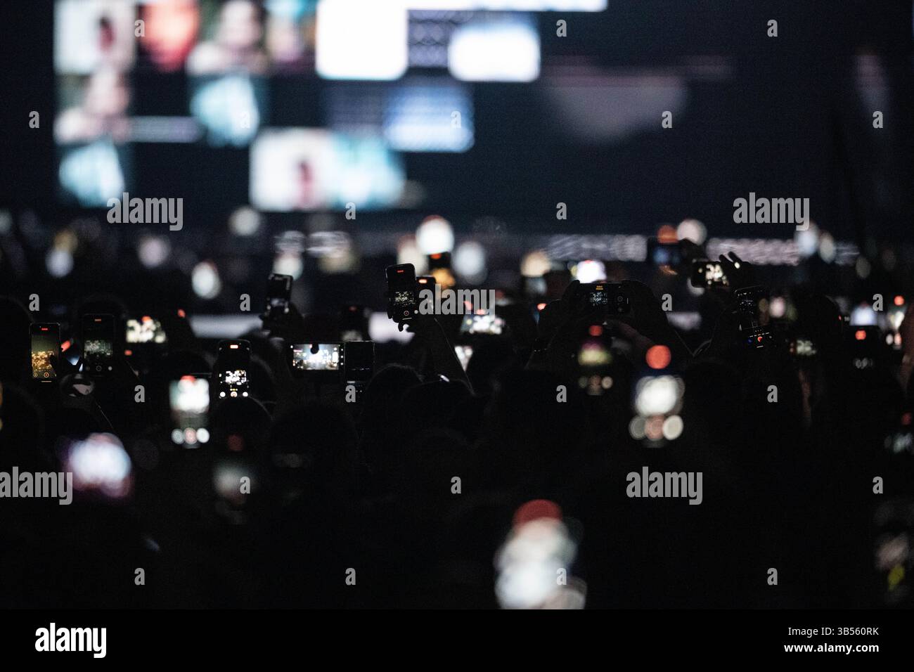 Berlin, Germany. 01st May, 2025. Visitors to the concert hold up their ...