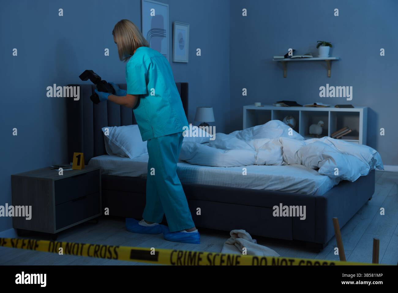 Forensic expert with camera working at crime scene indoors Stock Photo ...