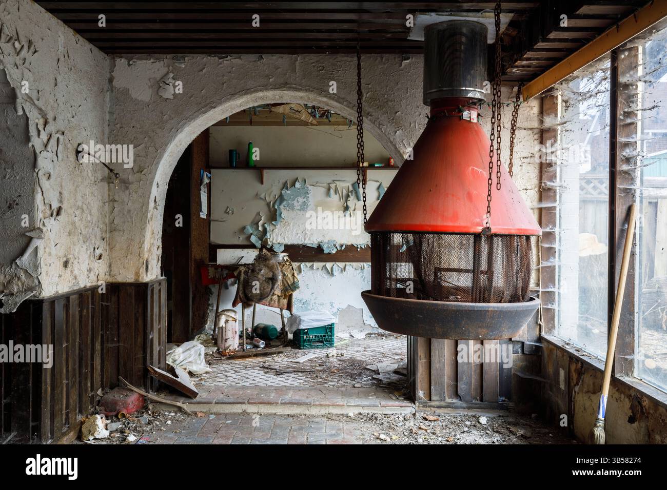 A suspended fireplace inside an abandoned home. This house has since been demolished Stock Photo