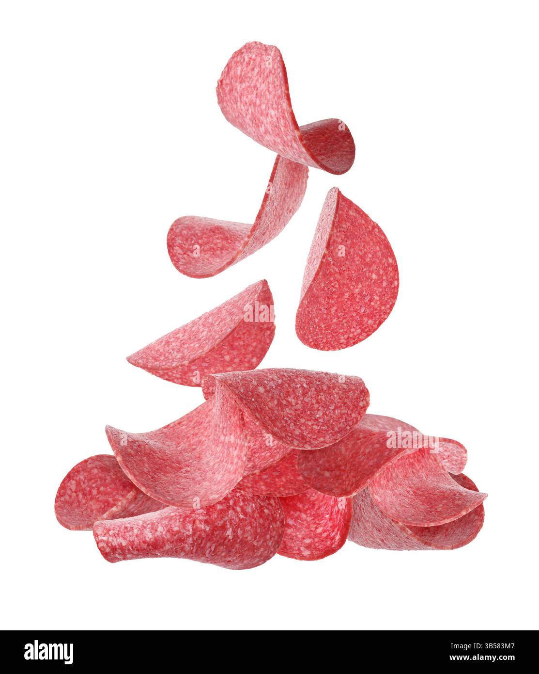 Salami sausage slices falling on white background Stock Photo