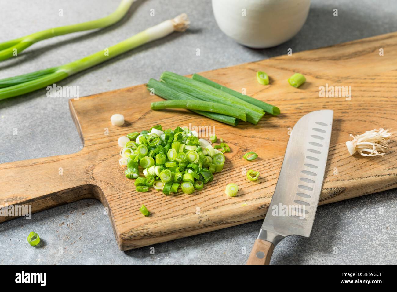 Green Organic Cut Green Onion Scallions on a Cutting Board Stock Photo ...