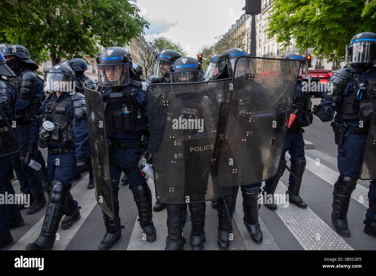 Paris, France. 01st May, 2025. French riot police retreat from a ...