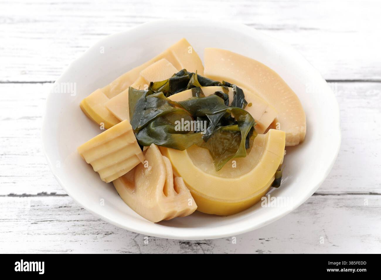 Boiled bamboo shoots in a plate on table, Traditional Japanese cuisine Stock Photo