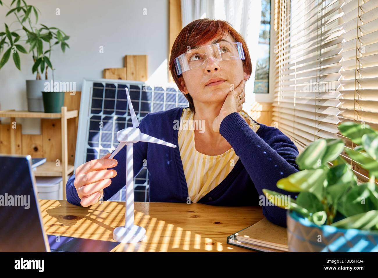 Spectacles Analysis Model Business woman wearing augmented reality glasses analysis wind turbine ...