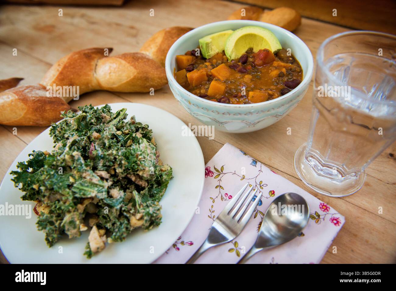 Rustic Plant-Based Lunch with Chili and Creamy Kale Salad Stock Photo ...